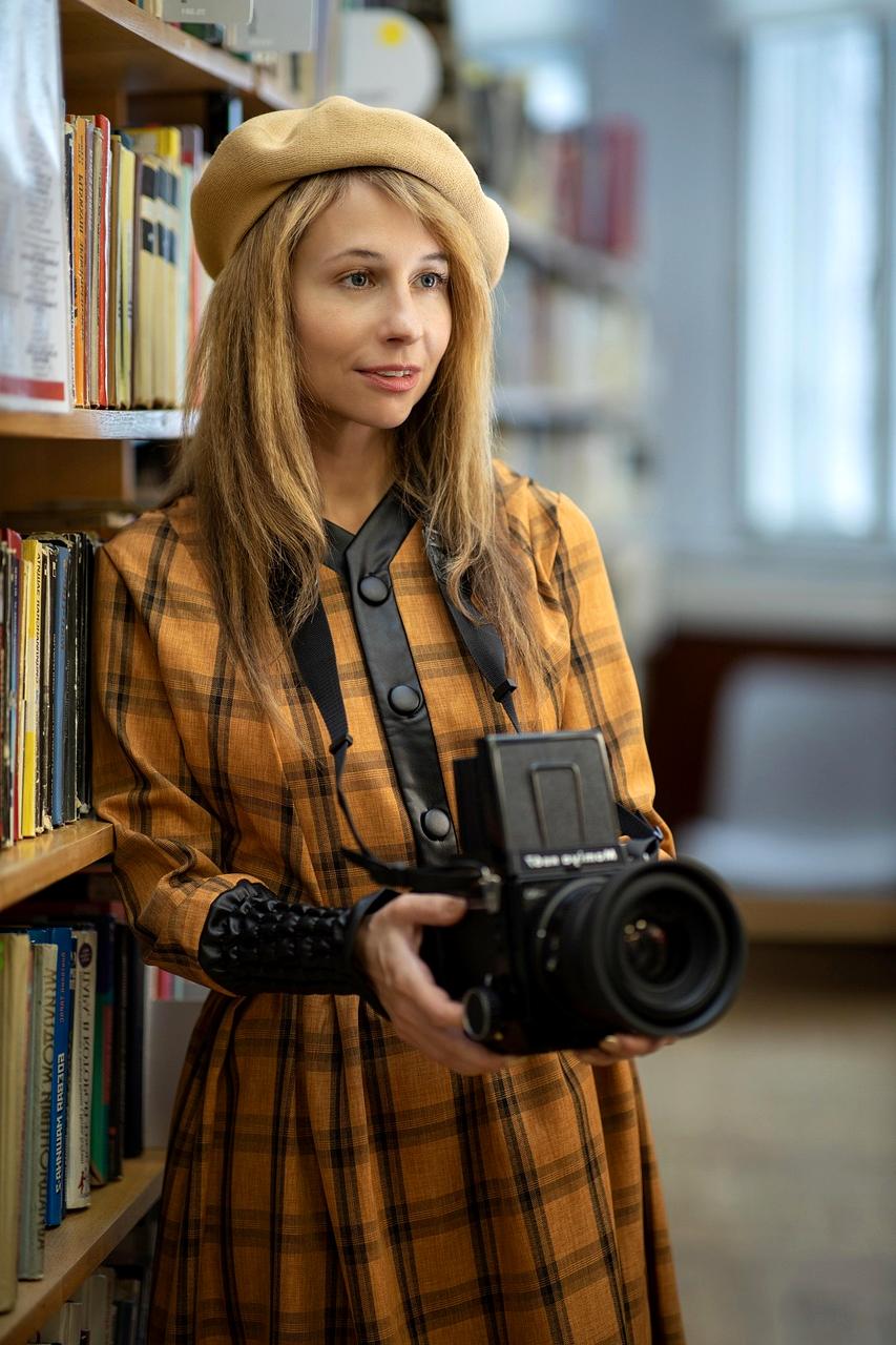 Journalist working in modern newsroom